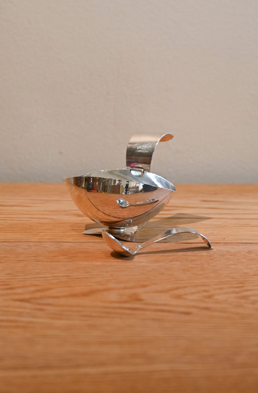 Vintage metal sauce dish with spoon